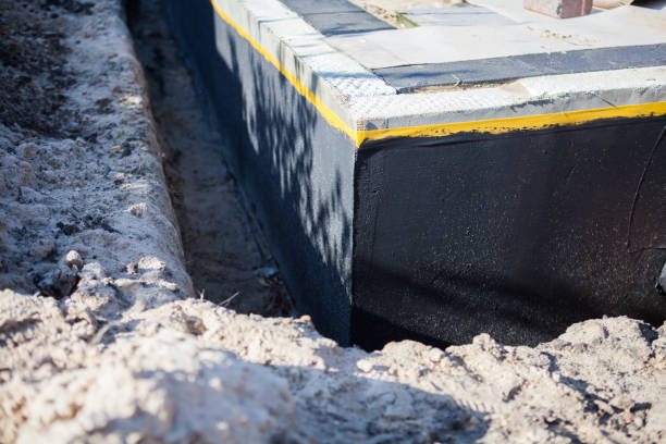 Professional Waterproofing technician working in Leopolis, WI